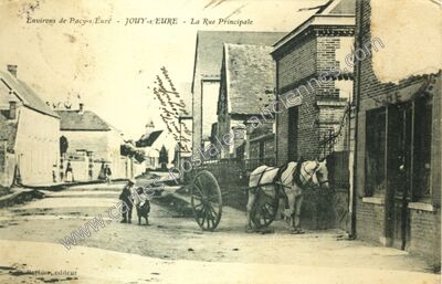 Carte postale ancienne La Rue Principale — Jouy-sur-Eure (Eure)