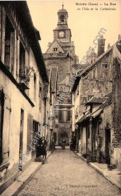 Carte postale ancienne La Rue de l'Isle et la Cathédrale — Gisors (Eure)