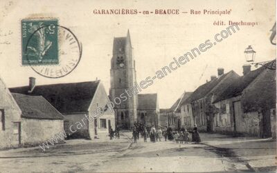 Carte postale ancienne Rue Principale — Garancières-en-Beauce (Eure-et-Loir)