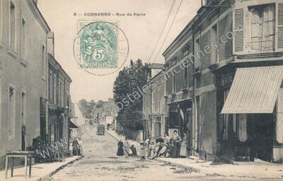 Carte postale ancienne Rue de Paris — Connerré (Sarthe)