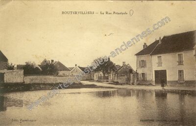 Carte postale ancienne La Rue Principale — Boutervilliers (Essonne)