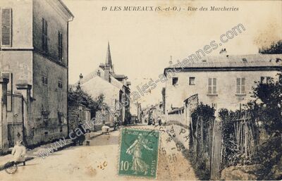Carte postale ancienne Rue des Marcheries — Les Mureaux (Yvelines)